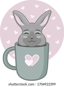 Conejo gris cortado sentado en una taza verde 