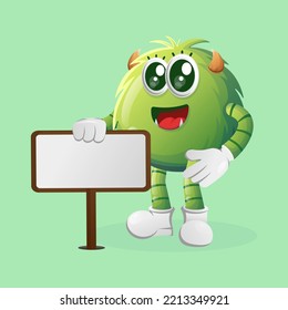 Cute green monster standing next to a billboard. Perfect for kids, small business or e-Commerce, merchandise and sticker, banner promotion, blog or vlog channel

