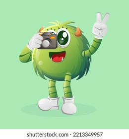 Cute green monster taking photo with camera. Perfect for kids, small business or e-Commerce, merchandise and sticker, banner promotion, blog or vlog channel
