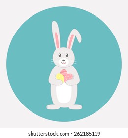 Cute grey rabbit with Easter eggs