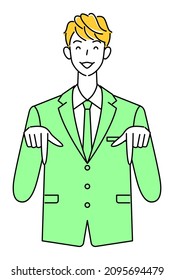 A cute guy in a suit smiling and pointing his finger in the direction below. Business person illustration vector