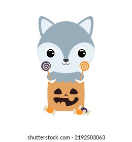 Cute Halloween wolf sitting in a trick or treat bag with candies. Cartoon animal character for kids t-shirts, nursery decoration, baby shower, greeting card, invitation. Vector stock illustration