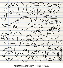 Cute hand drawn animal heads isolated on a notebook page