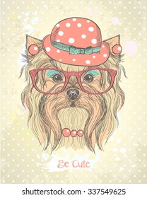 Cute hand drawn card with fashion yorkshire terrier girl, dressed in hat, earrings,necklace and glasses with makeup on her muzzle. Quote card - Be cute.