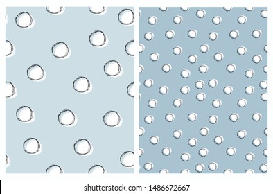 Cute Hand Drawn Dotted Vector Patterns. White and Black Dots Isolated on a Blue Background. Simple Irregular Dotted Print Ideal for Fabric, Textile, Wrapping Paper, Beby Boy Party Decoration.