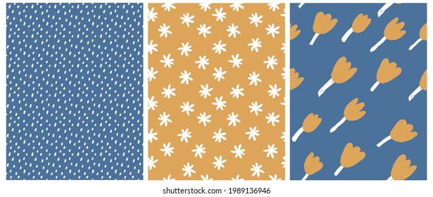 Cute Hand Drawn Floral and Geometric Seamless Vector Patterns. White Daisies and Gold Tulips Isolated on a Gold and Dark Blue Background. Infantile Style Floral Print. White Brush Spots on a Blue.