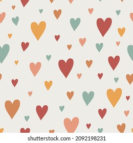 Cute hand drawn hearts seamless pattern. Cartoon children's background with colorful hearts. Funny vector illustration for fabric, packaging, scrapbooking. Doodle style heart.