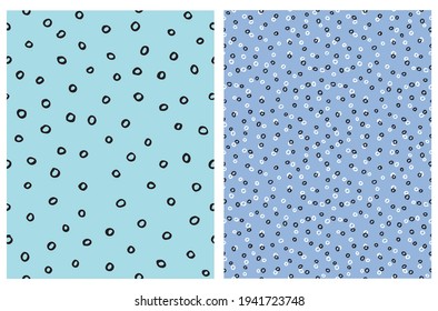 Cute Hand Drawn Irregular Dotted Vector Patterns with White and Black Circles Isolated on a Light Blue Background. Funny Infantile Style Geometric Print ideal for Fabric, Textile.