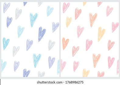 Cute Hand Drawn Irregular Hearts Seamless Vector Patterns. Blue and Pink Hearts Isolated on a White Background. Funny Infantile Style Romantic Design. Pastel Pink and Light Blue Doodle Hearts.