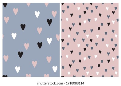 Cute Hand Drawn Irregular Hearts Vector Patterns. White, Black, Pink and Blue Hearts on a Light Pink and Pale Blue Background. Funny Romantic Infantile Style Print. Love Symbol.