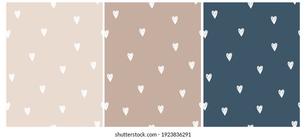 Cute Hand Drawn Irregular Romantic Seamless Vector Pattern. White  Hearts Isolated on a Light Cream, Dusty Brown and Dark Blue Background. Funny Infantile Repeatable Print.