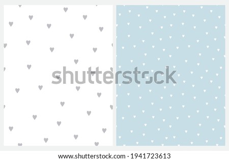 Cute Hand Drawn Irregular Romantic Vector Patterns with Tiny Hearts Isolated on a Light Blue and White Background. Funny Infantile Style Hearts Print.