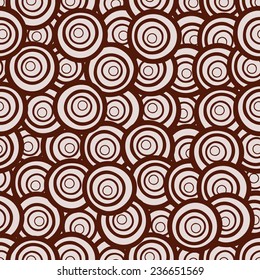 Cute hand drawn seamless pattern with circles in retro style. Background in pink and brown colors. Vector illustration can be copied without any seams.