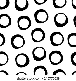 Cute hand drawn seamless pattern with circles in modern style. Background in black and white colors. Monochrome texture. Vector illustration can be copied without any seams. 
