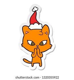 cute hand drawn sticker cartoon of a cat wearing santa hat