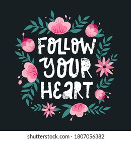 cute hand lettering typography quote 'Follow your heart' decorated with flowers and leaves. Good for feminist inspirational posters, cards, prints, banners, etc. EPS 10