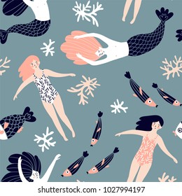 Cute hand-drawn seamless pattern with mermaids, swimming girls and corals. Magic endless design for fabric, wrap paper or wallpaper.