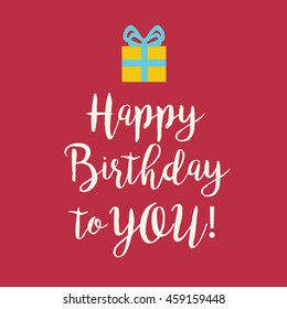 Cute Happy Birthday to You greeting card with a handwritten text and an orange wrapped birthday gift with teal ribbon bow on pink red background.