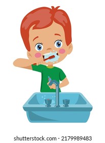 cute happy boy brushing his teeth