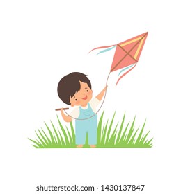 Cute Happy Boy Enjoying Flying Kite on Green Meadow, Adorable Little Kid Cartoon Character Playing Outside Vector Illustration