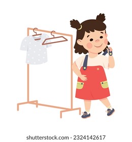 Cute happy brunette little girl dressing herself up. Child in everyday activities cartoon vector illustration