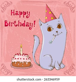 Cute happy cat wearing a paper hat with a birthday cake