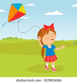 Cute happy child girl with a kite running on meadow in summer in nature