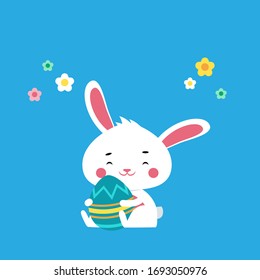 Cute and happy easter bunny hugging a giant egg celebrating holday. Festive concept