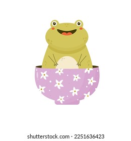 Cute happy frog sitting inside a bowl. Funny adorable animal toad character