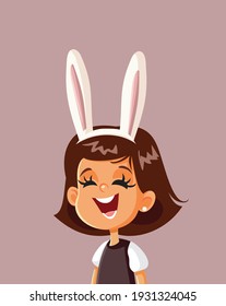 Cute Happy Girl with Bunny Ears Celebrating Easter. Cheerful child laughing enjoying springtime holidays
