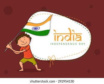 Cute happy kid holding and waving national flag for Happy Indian Independence Day celebration.