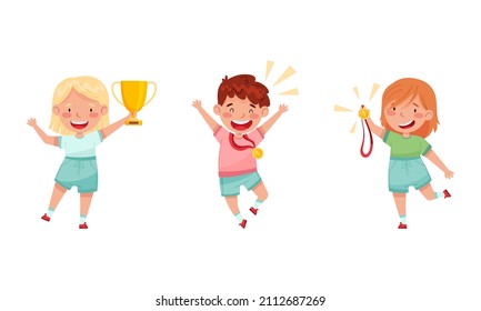 Cute happy kids celebrating victory in game competition with trophy cup and medal set vector illustration