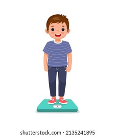 cute happy little boy child standing on the weighing scale checking his weight