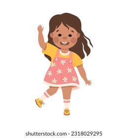 Cute happy little girl waving Hello. Brunette girl dressed yellow t-shirt and pink sundress showing greeting gesture cartoon vector illustration