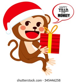 Cute happy monkey wearing Santa Claus hat on Christmas with big red box present