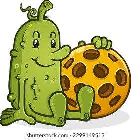 A cute happy pickleball pickle cartoon mascot sitting and holding an oversized yellow plastic pickleball