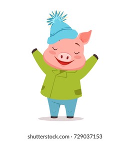 Cute happy pig in green warm coat and blue knitted hat, funny cartoon animal dressed in human clothes vector Illustration