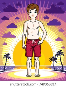 Cute happy young teen boy posing wearing fashionable beach shorts. Vector character. Childhood lifestyle clipart.