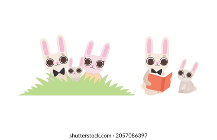 Cute Hare Family with Mother, Father and Cub Sitting in Grass and Reading Book Vector Set