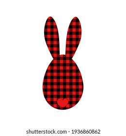A cute hare with long ears sits with its back on a white background. Rabbit in a red-black checkered fabric. Easter bunny applique. Vector graphics.