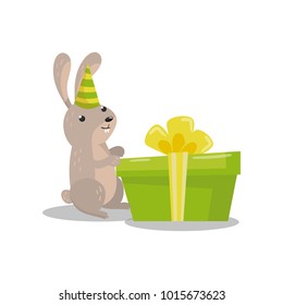 Cute hare in party hat with big green gift box cartoon vector Illustration