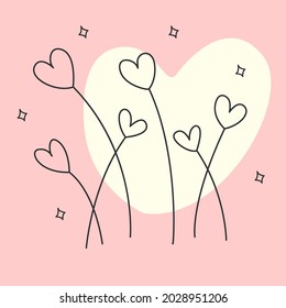 El corazón forma césped con forma de corazón fino adornado con flores en un fondo rosa pastel