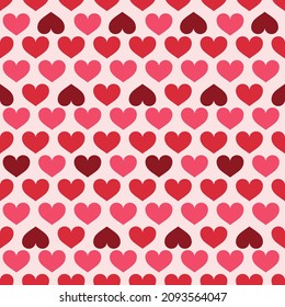 A cute hearts in classic half drop line pattern with flips for added interest in pink and red seamless pattern for a romantic Valentines Day Holiday