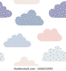 Cute heavenly set of  clouds covered with adorable dots in soft pastel tones