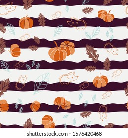 A cute Hedgedog with pumpkins and leaves all around, in an autumn atmosphere