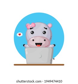 Cute hippo using a laptop