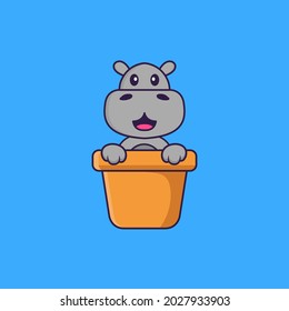 Cute hippopotamus in a flower vase. Animal cartoon concept isolated. Can used for t-shirt, greeting card, invitation card or mascot. Flat Cartoon Style