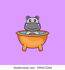 Cute hippopotamus taking a bath in the bathtub. Animal cartoon concept isolated. Can used for t-shirt, greeting card, invitation card or mascot.
