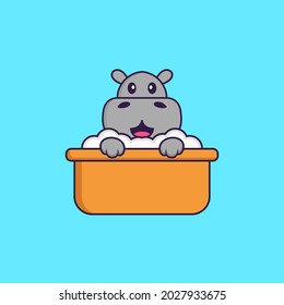 Cute hippopotamus taking a bath in the bathtub. Animal cartoon concept isolated. Can used for t-shirt, greeting card, invitation card or mascot.