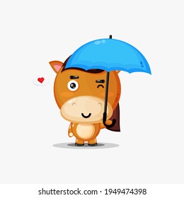 Cute horse carrying an umbrella